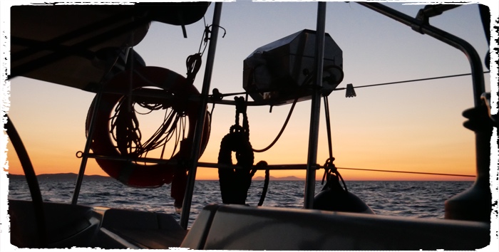 Sun rays are starting to cut the night on the passage to Crete